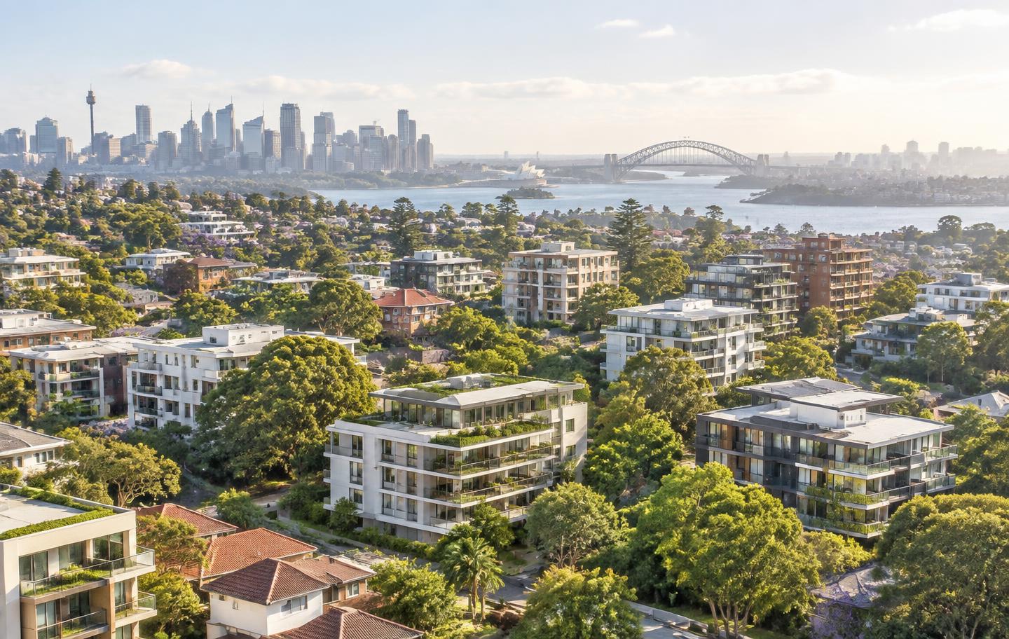 Aerial view of Sydney strata neighbourhoods with the harbour skyline